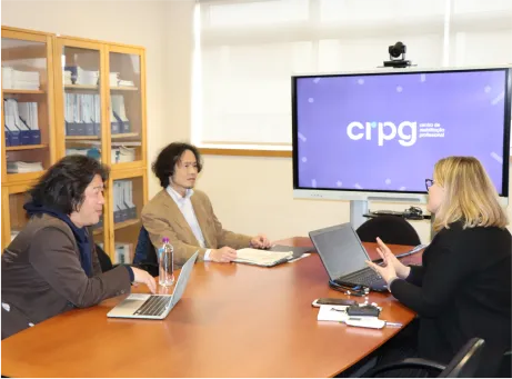 professores sentados à mesa durante apresentação do CRPG