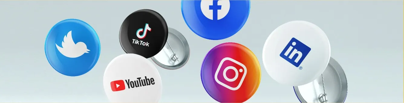 Pins com icons de diversas redes sociais